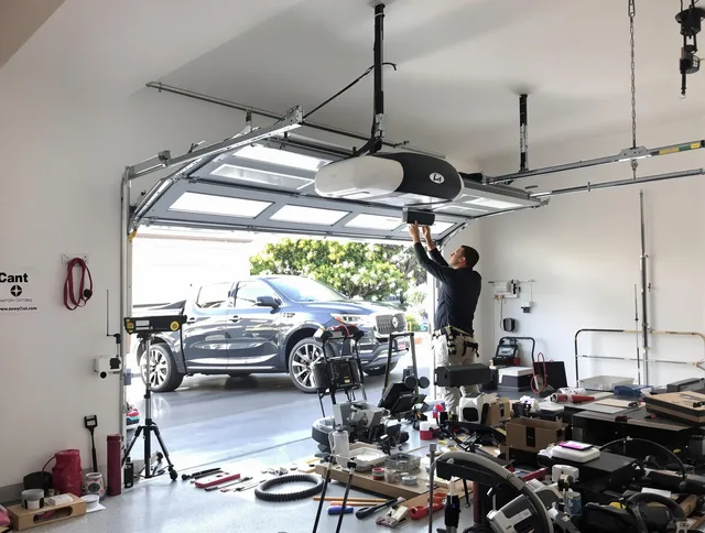 French Valley Garage Door Repair specialist installing smart garage door opener system in French Valley home