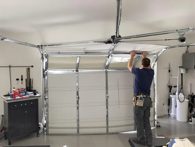 French Valley Garage Door Repair specialist performing precise section replacement on French Valley garage door